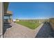 Backyard featuring a lawn, gravel perimeter, and a wooden fence around the property at 17788 Olive St, Broomfield, CO 80023