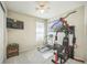 Bedroom featuring a ceiling fan, exercise equipment, and a mounted television at 17788 Olive St, Broomfield, CO 80023