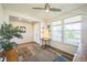 Bright entryway with wood floors, neutral walls, front door, ceiling fan and lots of light from the windows at 17788 Olive St, Broomfield, CO 80023