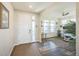 Bright foyer with hardwood floors, an office space, and a welcoming entryway creating an inviting first impression at 17788 Olive St, Broomfield, CO 80023