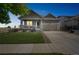 Charming single-Gathering home with craftsman-style front porch and manicured lawn at 17788 Olive St, Broomfield, CO 80023