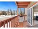 Exterior balcony featuring wood floors, barbecue, and red railings at 303 Pelican Cir # 1901, Breckenridge, CO 80424