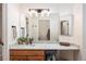 Bright bathroom with granite countertops and vanity with large mirror at 303 Pelican Cir # 1901, Breckenridge, CO 80424