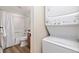 Bathroom with combination tub/shower and stacked washer and dryer at 303 Pelican Cir # 1901, Breckenridge, CO 80424