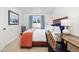 Comfortable bedroom with a wood frame bed, a desk, and bright natural light at 303 Pelican Cir # 1901, Breckenridge, CO 80424