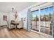 Bright dining area featuring a chandelier and large sliding doors to the exterior at 303 Pelican Cir # 1901, Breckenridge, CO 80424