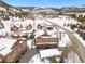 Scenic mountain homes nestled in a snow-covered landscape with mature trees at 303 Pelican Cir # 1901, Breckenridge, CO 80424