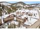 Mountain homes with snow-covered roofs and evergreens in a scenic landscape at 303 Pelican Cir # 1901, Breckenridge, CO 80424