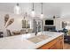 A kitchen with stainless steel sink and mountain decor on the wall at 303 Pelican Cir # 1901, Breckenridge, CO 80424