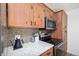 The kitchen includes stainless steel appliances and stone countertops at 303 Pelican Cir # 1901, Breckenridge, CO 80424