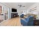 The open-concept living room includes a fireplace, flat screen tv, and a mountain ski themed decor at 303 Pelican Cir # 1901, Breckenridge, CO 80424
