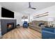The open-concept living room includes a fireplace, flat screen tv, and mountain themed decor at 303 Pelican Cir # 1901, Breckenridge, CO 80424
