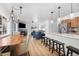 Open-concept living area with hardwood floors, fireplace, and modern lighting fixtures at 303 Pelican Cir # 1901, Breckenridge, CO 80424