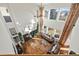 Spacious living room featuring hardwood floors, a fireplace, and large windows providing natural light at 10908 Eagle Run Dr, Parker, CO 80138