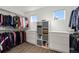 Large walk-in closet with custom shelving and ample storage space at 10908 Eagle Run Dr, Parker, CO 80138