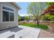 Backyard patio featuring a stone path and grass at 10685 Cherrybrook Cir, Highlands Ranch, CO 80126