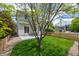 Beautiful backyard featuring a lawn, fence and a small patio at 10685 Cherrybrook Cir, Highlands Ranch, CO 80126