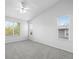 Carpeted room featuring a vaulted ceiling, a ceiling fan, and two windows with blinds at 10685 Cherrybrook Cir, Highlands Ranch, CO 80126