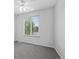Clean bedroom with a ceiling fan and light, carpet, window and white walls at 10685 Cherrybrook Cir, Highlands Ranch, CO 80126