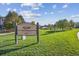 Spearwood Park at Firelight has lush green grass, mature trees, and is for use solely by residents at 10685 Cherrybrook Cir, Highlands Ranch, CO 80126