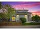 Exterior of a home with a fence and lush landscaping during sunset at 10685 Cherrybrook Cir, Highlands Ranch, CO 80126