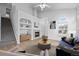 Cozy living room with a fireplace, built-in shelving, and comfortable seating at 10685 Cherrybrook Cir, Highlands Ranch, CO 80126