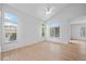 Spacious living room with vaulted ceilings, hardwood floors, and abundant natural light at 10685 Cherrybrook Cir, Highlands Ranch, CO 80126