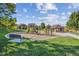 Community playground with swings, slides, climbing structures, seating, and a covered picnic area at 10685 Cherrybrook Cir, Highlands Ranch, CO 80126