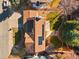 An aerial view of the roof, solar panels, and a manicured backyard with patio at 12752 W Dakota Ave, Lakewood, CO 80228