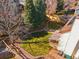An aerial view of the backyard which features patio furniture and a manicured lawn at 12752 W Dakota Ave, Lakewood, CO 80228