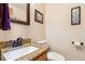 Bathroom featuring granite countertop, framed mirror and fixtures at 12752 W Dakota Ave, Lakewood, CO 80228