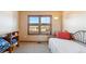 Simple bedroom with natural light and neutral decor at 12752 W Dakota Ave, Lakewood, CO 80228