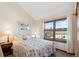 Relaxing bedroom with a bright window and cozy decor at 12752 W Dakota Ave, Lakewood, CO 80228