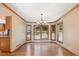 Elegant dining room with hardwood floors, a bay window, and chandelier lighting at 12752 W Dakota Ave, Lakewood, CO 80228