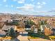 Two story home boasts mature landscaping, solar panels, attached two car garage, and beautiful mountain views at 12752 W Dakota Ave, Lakewood, CO 80228