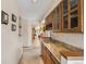 The stylish bar area features granite countertops, wine storage, and elegant cabinetry, ideal for entertaining and relaxation at 4992 White House Trl, Evergreen, CO 80439