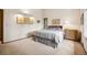 Cozy bedroom with a large window, natural light, and carpeted floors at 4992 White House Trl, Evergreen, CO 80439