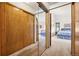 Bedroom with mirrored closet doors leading to the sleeping area with beautiful window views at 4992 White House Trl, Evergreen, CO 80439