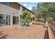 Beautiful wooden deck features a built in seat, and a tree growing from a boulder at 4992 White House Trl, Evergreen, CO 80439
