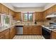 Well-lit kitchen features updated appliances, granite countertops, and ample cabinet space, offering a delightful cooking experience at 4992 White House Trl, Evergreen, CO 80439