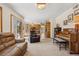 Spacious living room with access to the exterior deck and an open view to the dining and kitchen areas at 4992 White House Trl, Evergreen, CO 80439