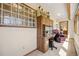 Office area with custom desk, storage cabinets, and natural light at 4992 White House Trl, Evergreen, CO 80439