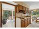 Convenient wet bar with wood cabinets and countertop, perfect for entertaining at 4992 White House Trl, Evergreen, CO 80439