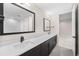 Double vanity featuring modern black fixtures and large mirrors, creating a functional and stylish space at 8014 Trinity Peak Ln, Castle Rock, CO 80108
