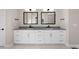 Elegant bathroom with dual sinks, sleek countertops, and modern mirrors create a harmonious space at 8014 Trinity Peak Ln, Castle Rock, CO 80108