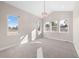 Bright bedroom with vaulted ceiling, carpet, and three windows letting in natural light and outdoor views at 8014 Trinity Peak Ln, Castle Rock, CO 80108