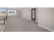 Spacious bonus room with neutral carpeting, large windows, and an abundance of natural light at 8014 Trinity Peak Ln, Castle Rock, CO 80108