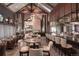 Elegant dining area with bar and vaulted ceilings at 8014 Trinity Peak Ln, Castle Rock, CO 80108