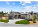 Beautiful two-story home with a circular lawn and three car garage in a desirable neighborhood at 8014 Trinity Peak Ln, Castle Rock, CO 80108