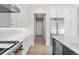 Modern kitchen featuring white cabinets, stainless steel appliances, and marble countertops at 8014 Trinity Peak Ln, Castle Rock, CO 80108